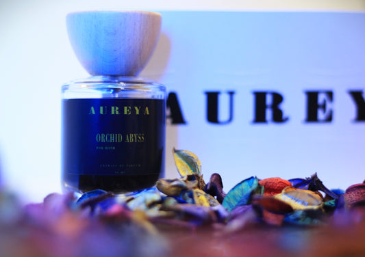 Orchid Abyss perfume bottle dark blue lighting luxury packaging inspired by Black Orchid Egypt